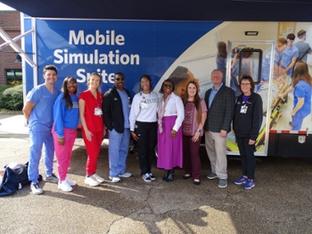 The DABE team members welcome the Mobile Simulation Suite with excitement for expanding their reach. From left to right the team members are Andrew Shelby, Deshundra Barnes, Julia Garletts, Patrick Parker, Janeese Knight, Joyce Shelby, Kristina Readman, Jereme King, and Tina Reeves.